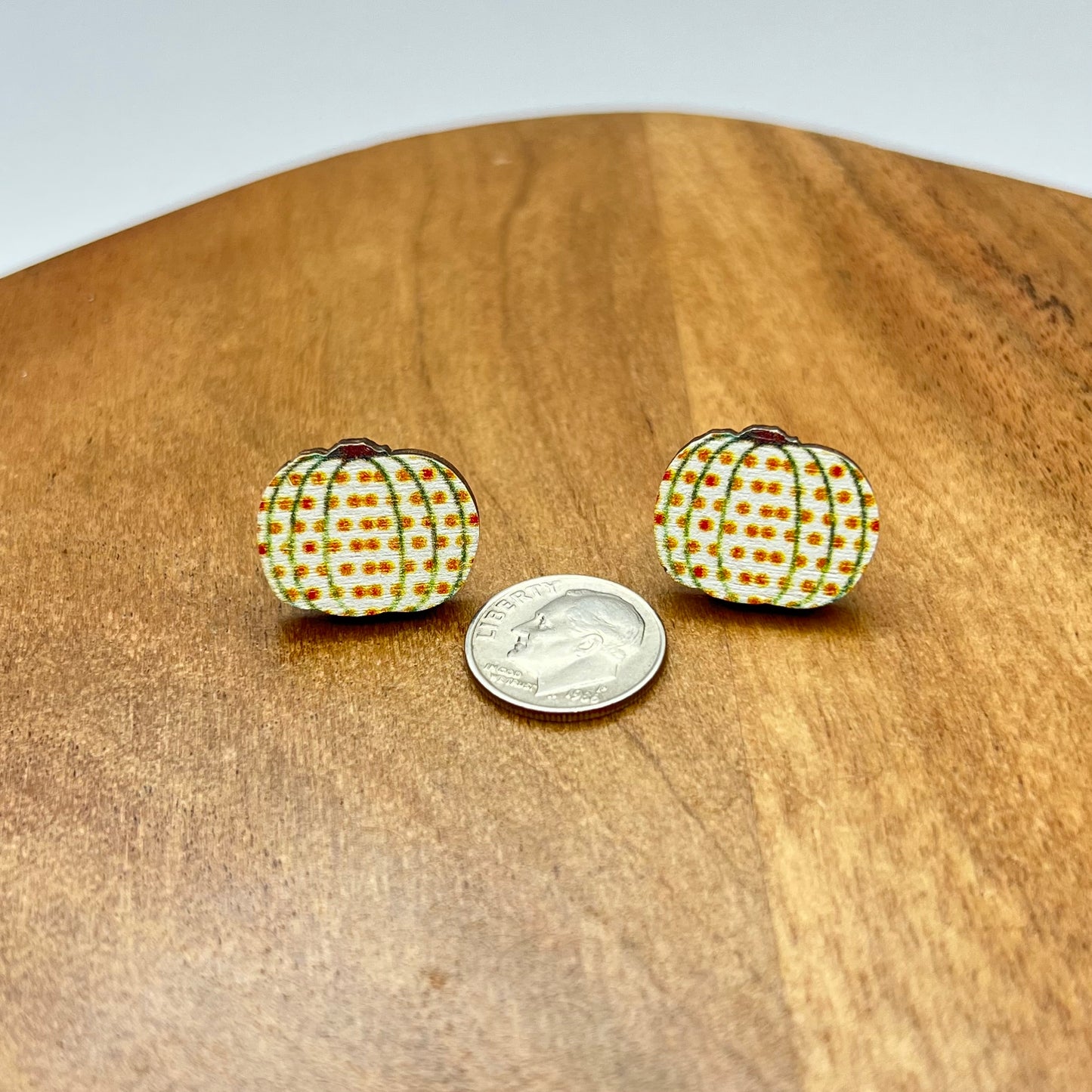 white pumpkin earrings with polka dots